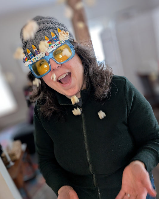 Full of whimsy, Karen tosses a few popcorn kernels skyward.